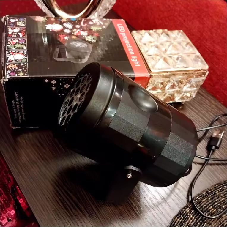 Winterglow LED snowflake projector with its box